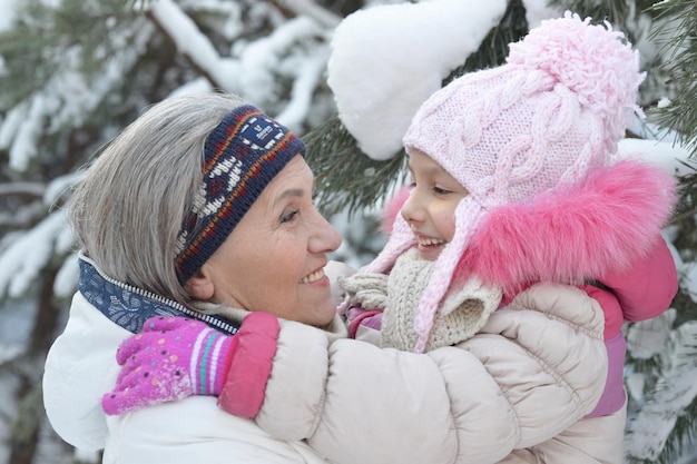 Portrait of grandmother and granddaughter in winter