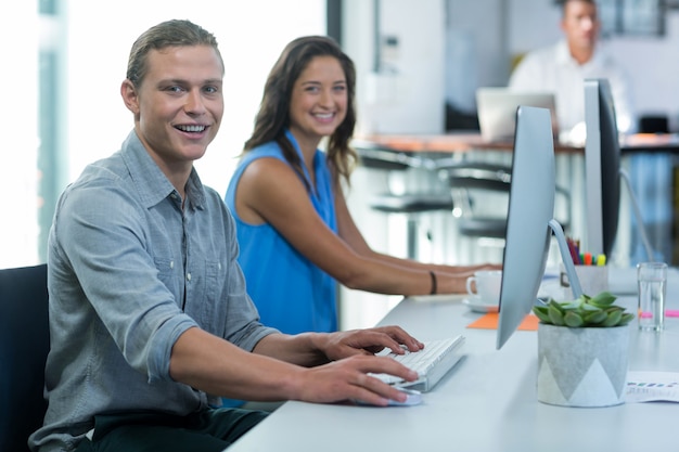 Portrait of graphic designers working on personal computer