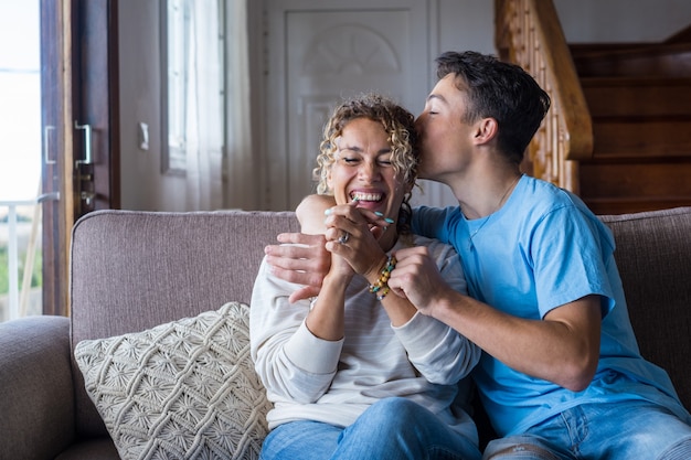 Portrait of grateful teenager man hug smiling middleaged mother show love and care thankful happy