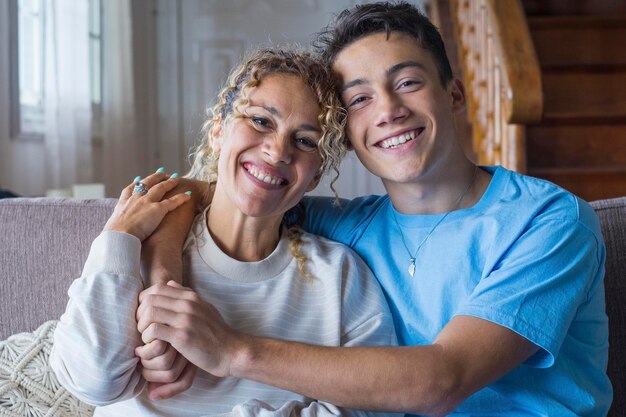 Photo portrait of grateful teenager man hug smiling middleaged mother show love and care