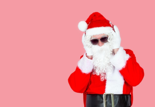 Portrait of a gray-haired old man in a Santa Claus costume