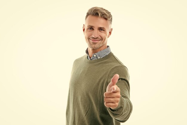 portrait of grizzled man pointing finger studio shot face of grizzled man mature grizzled man portrait with stubble isolated on white background face of grizzled man in sweater