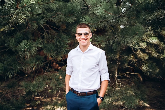 Portrait of a groom posing in nature