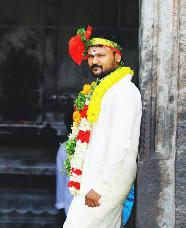 फोटो portrait of groom standing by wall