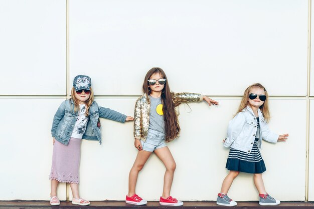 Portrait of a group of beautiful little girls posing outside