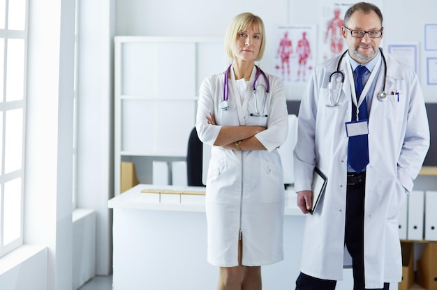 Portrait of group of smiling hospital colleagues standing together