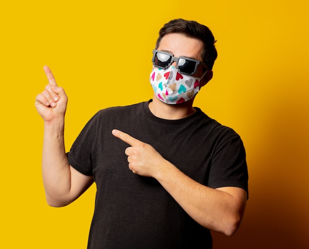 Portrait of guy in face mask and sunglasses