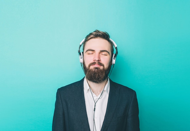 Portrait of a guy that is staying calm and listening to the music