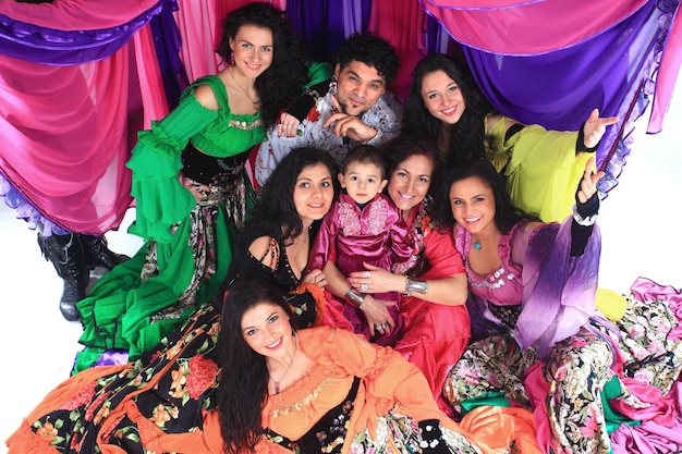 Portrait of a gypsy dance group on the background of the tent