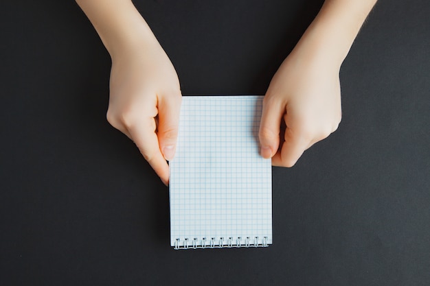 Portrait of hand, with blank notes