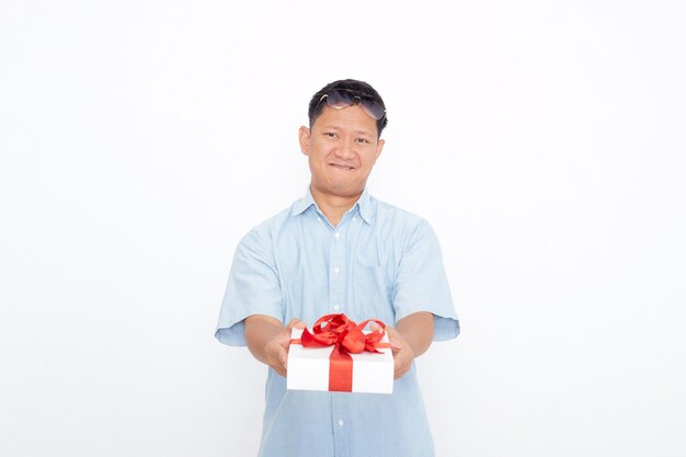 Portrait of Handsome Asian man holding gift box