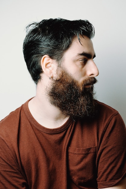 Portrait of a handsome bearded man, hipster style, serious, colorful, beauty and style concepts, lifestyle