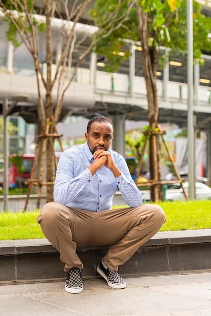 Portrait of handsome black man in city ready for business