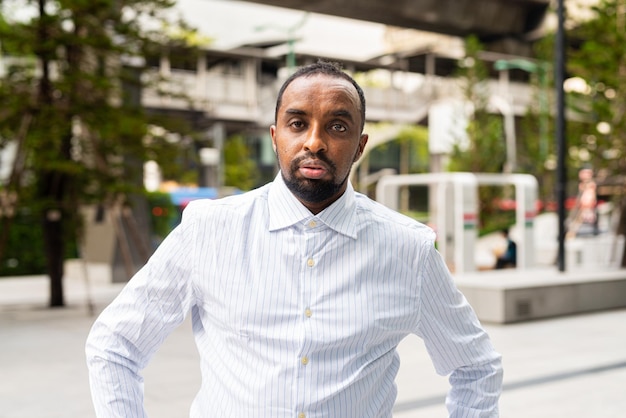 Portrait of handsome black man in city ready for business