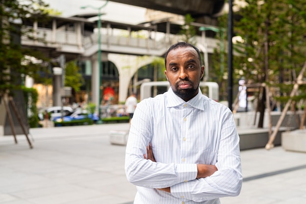 Portrait of handsome black man in city ready for business