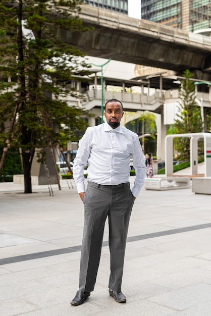 Portrait of handsome black man in city ready for business