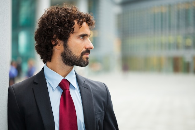 Portrait of an handsome businessman looking at his side