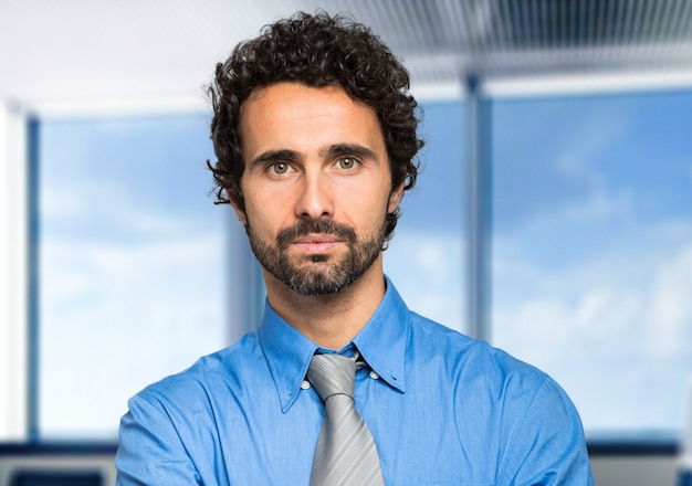 Portrait of a handsome businessman in a modern office