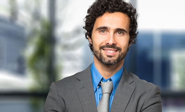 Portrait of a handsome businessman in a modern office