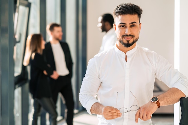 Portrait of handsome businessman in office