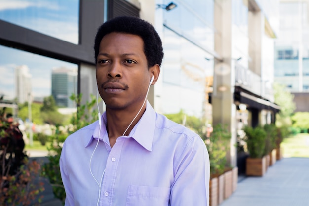 Portrait of an handsome businessman outdoor.