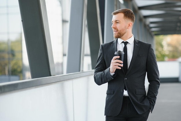 Portrait of an handsome businessman in an urban setting