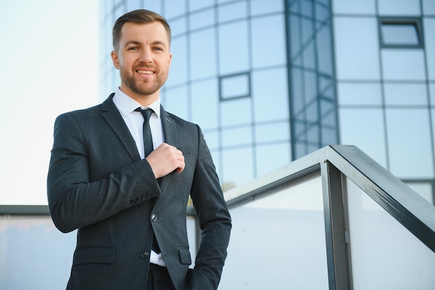 Portrait of an handsome businessman in an urban setting