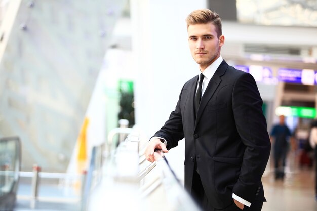 Portrait of an handsome businessman in an urban setting