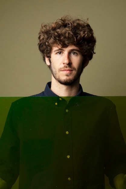 Portrait of handsome Caucasian man isolated on a green background