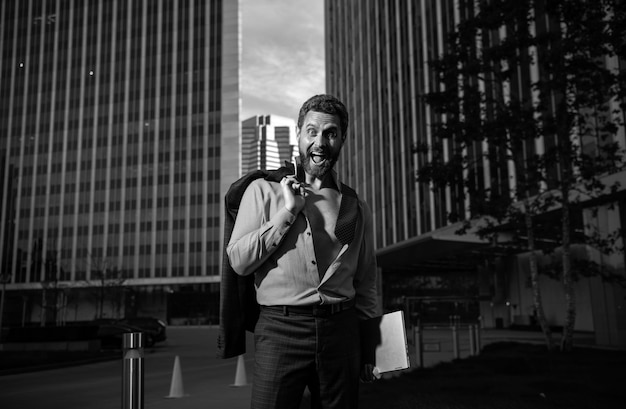 Portrait of a handsome ceo excited businessman in suit young sexy man