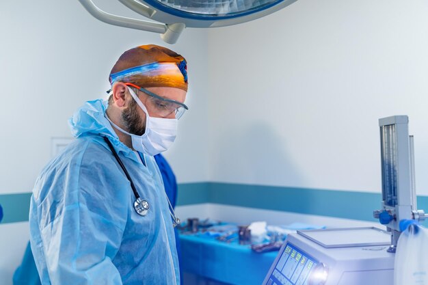 Portrait of handsome doctor in medical mask Emergency surgical help by professional man