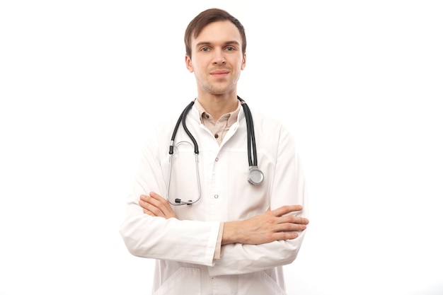 Portrait of handsome doctor in white medical coat with stethoscope on white background with copy space