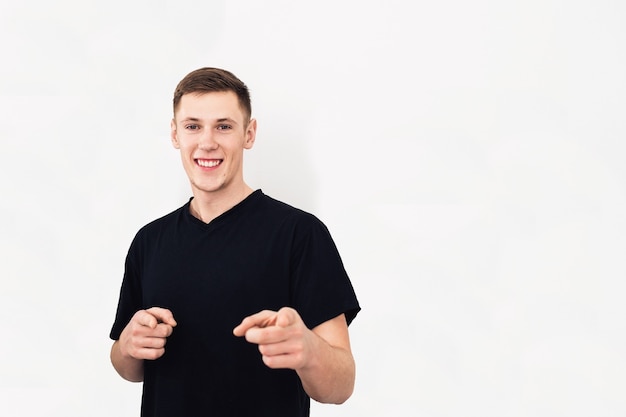 Portrait of handsome guy in black Tshirt posing