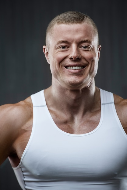 Portrait of a handsome guy in gym