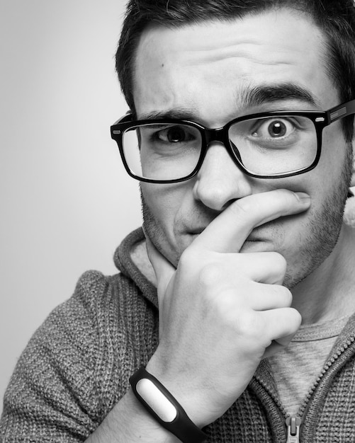 Portrait of a handsome guy with glasses Poor eyesight Vision correction Black and white photography