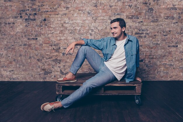 Portrait of handsome happy man having rest on weekend