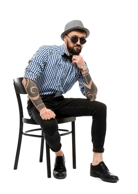 Portrait of handsome hipster in stylish outfit