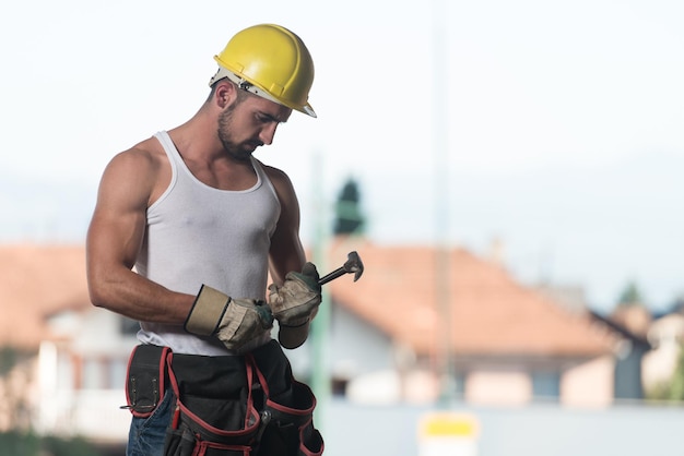 Portrait Of Handsome Male Architect Engineer With Yellow Helmet