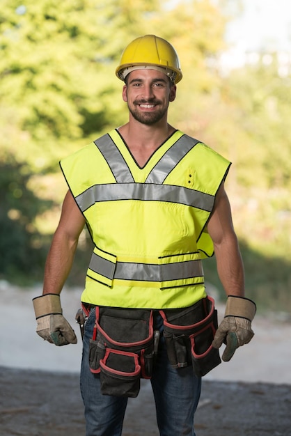 Portrait Of Handsome Male Architect Engineer With Yellow Helmet