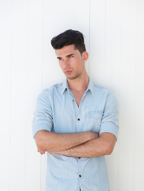 Portrait of a handsome male model with arms crossed