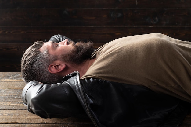 Portrait of handsome man bearded guy relaxing dreaming