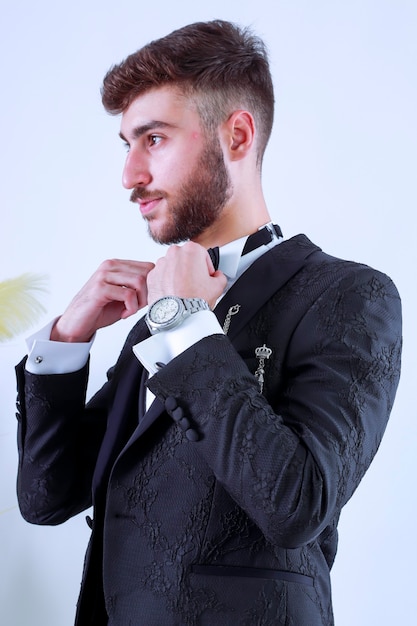 Portrait of handsome man in black suit