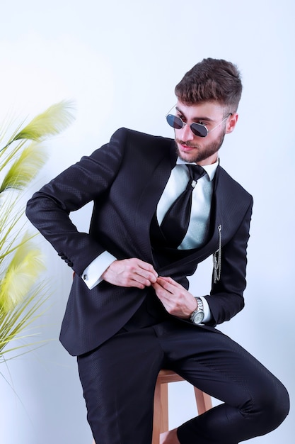 Portrait of handsome man in black suit