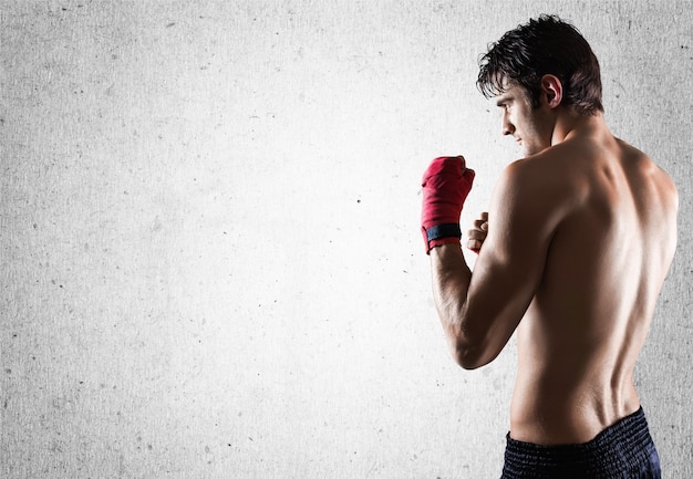 Portrait of a handsome man boxing isolated on  background