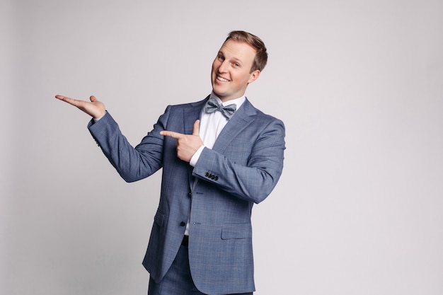 Portrait of handsome man in grey suit