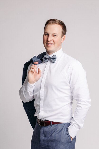 Portrait of handsome man in grey suit