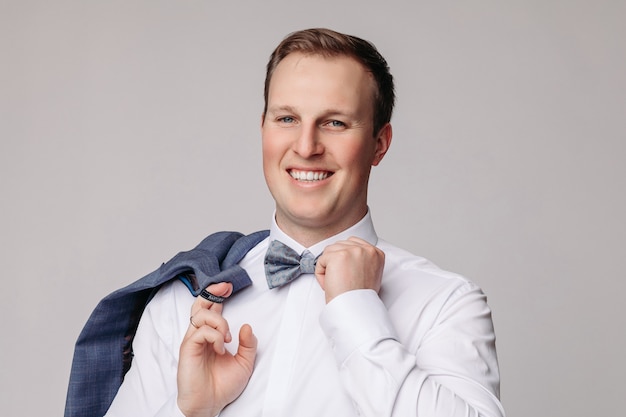 Portrait of handsome man in grey suit