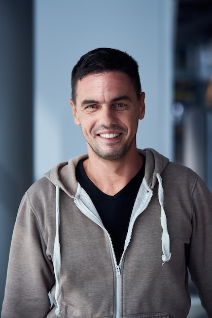 Portrait of handsome man in the hall of airport terminal