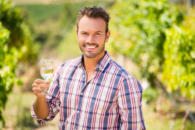 Portrait of handsome man holding wineglass