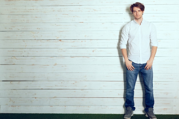 Portrait of a handsome man on old wooden 